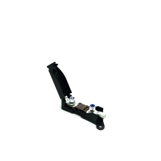 The fuse housing assembled with the fuse clamped in, seen at an angle