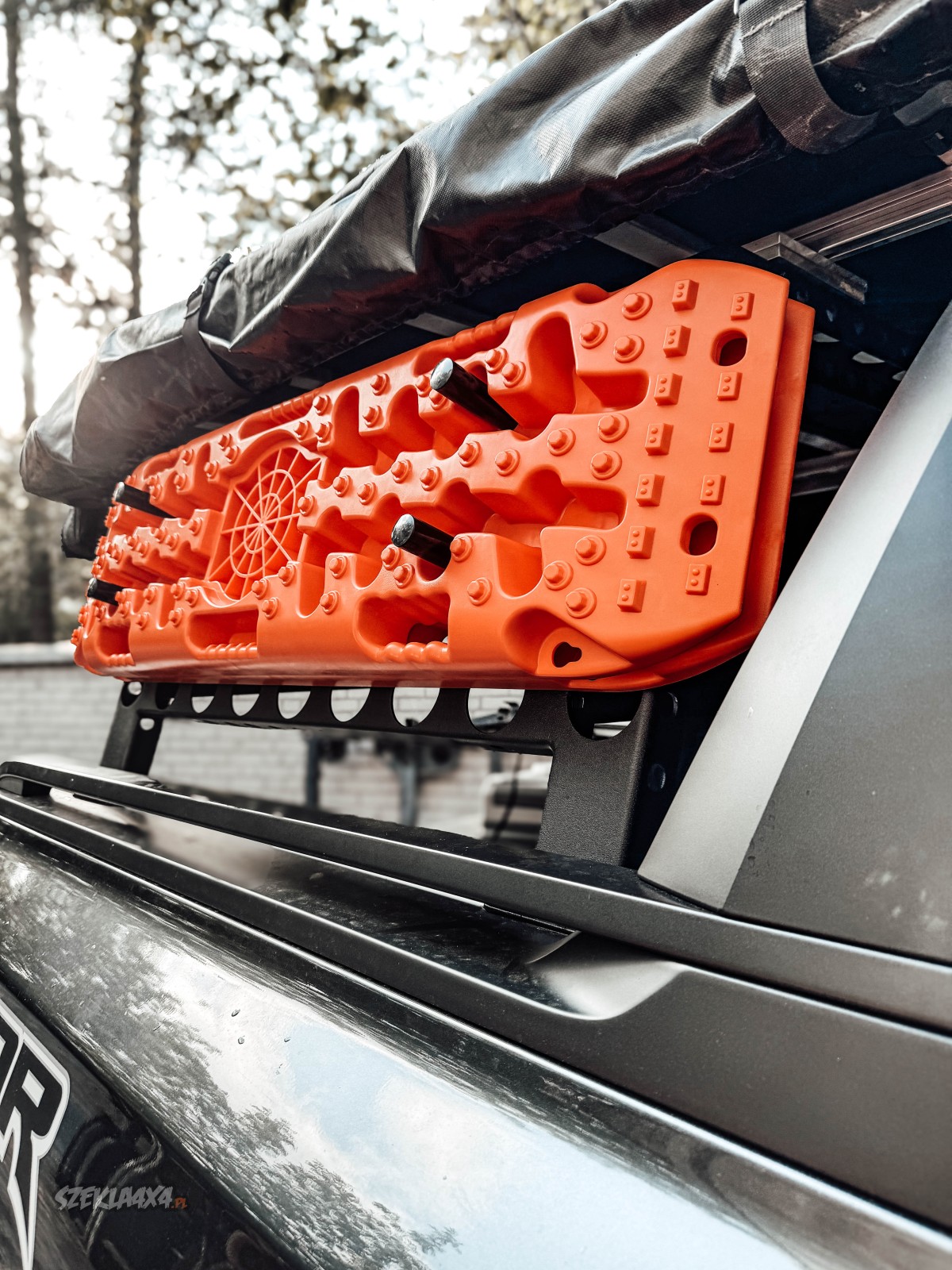 Wild Camp recovery boards mounted on the rack of a Ford Ranger Raptor – off-road gear